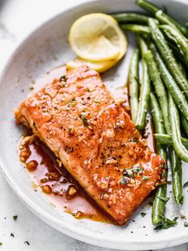 Saucy honey garlic salmon on a plate