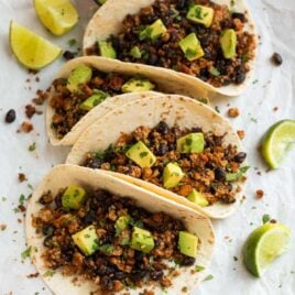 Quick and easy Tofu Tacos with black beans. Crispy, lightly spicy, and delicious! A high protein vegetarian meal that's ready in less than 30 minutes.