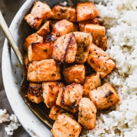 air fryer salmon bites in bowl with rice