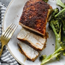 Baked pork chops on plate with broccoli