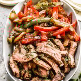 A bowl of beef fajitas and vegetables