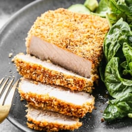 the best breaded pork chops recipe on a plate cut