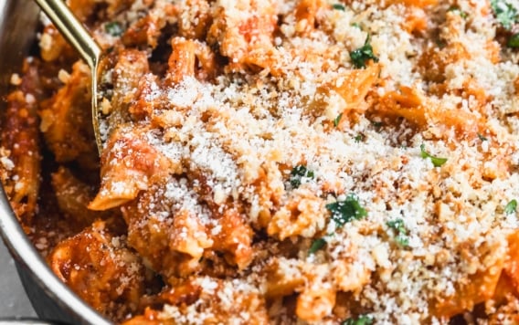a pan of cheesy chicken parmesan pasta