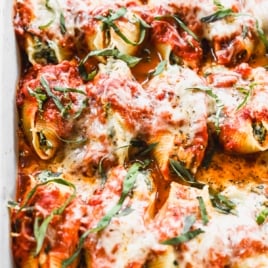 a pan of cheesy stuffed shells with ricotta, spinach and mozzarella