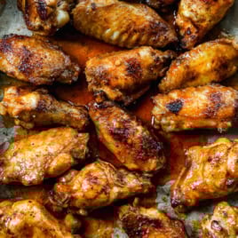 Overhead view of grilled chicken wings with Buffalo sauce