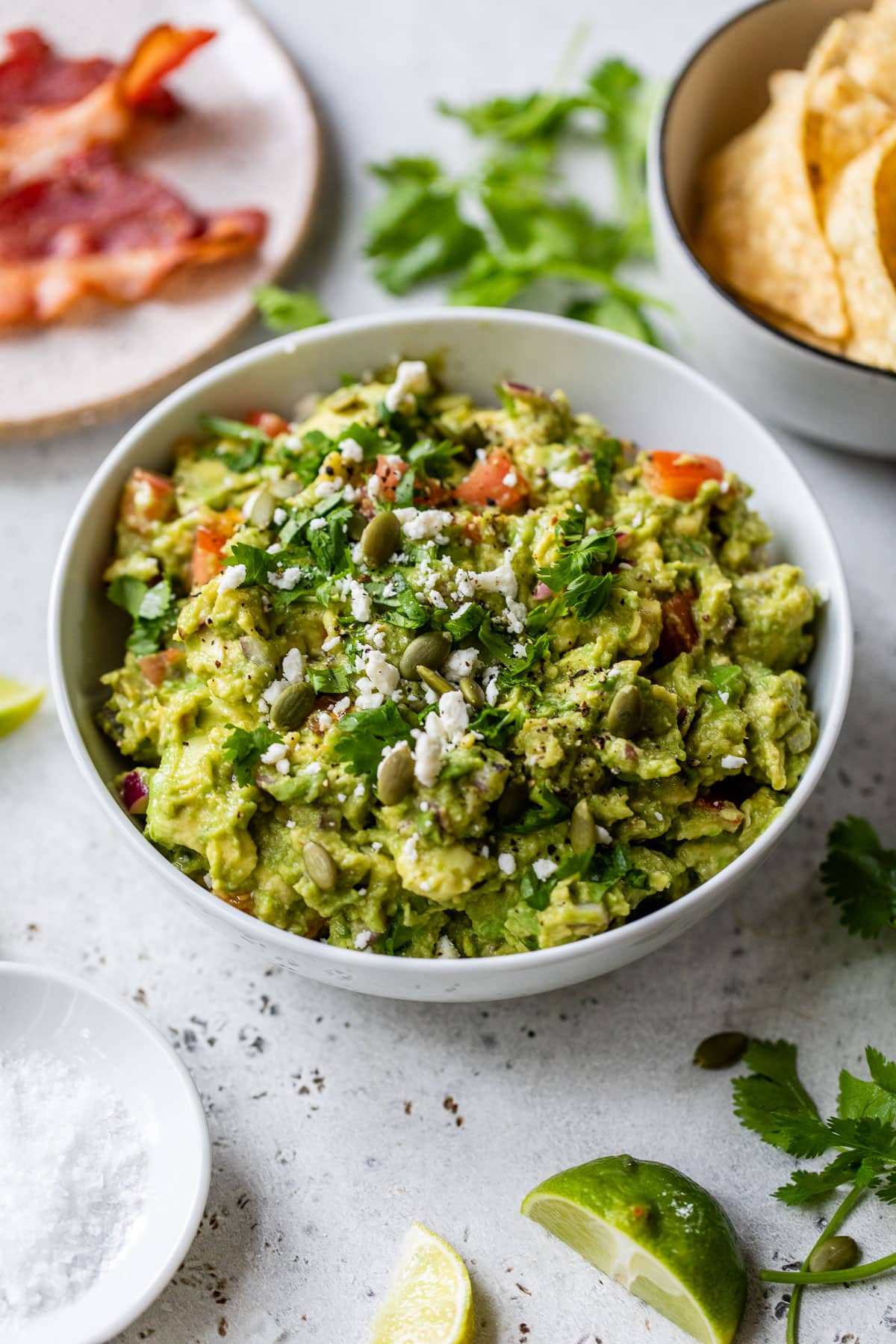 easy guacamole recipe for nachos with bacon, pepitas, and cilantro