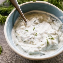 Homemade tzatziki sauce in bowl with spoon