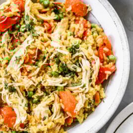 Easy instant pot chicken and rice with vegetables on a white plate