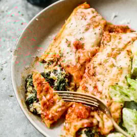 Spinach manicotti on plate