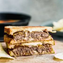 Patty melt sandwich on cutting board