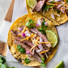 best steak tacos with cheese, cilantro, and red onion