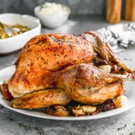 juicy roasted thanksgiving turkey on a platter for thanksgiving