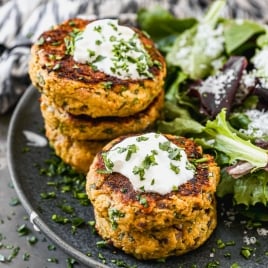 Crispy baked tuna cakes on plate with salad