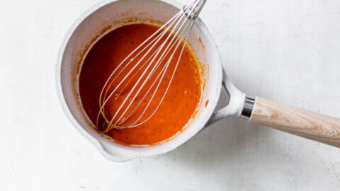 whisking buffalo sauce