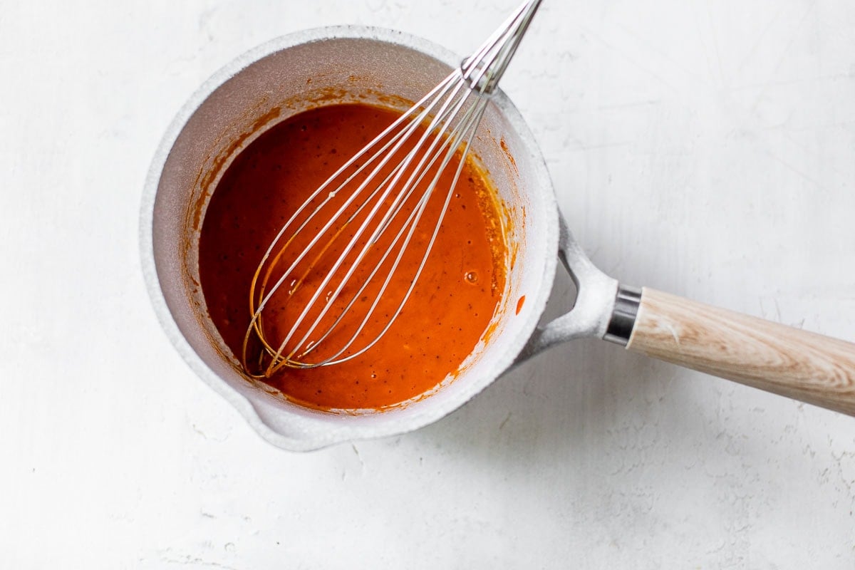 whisking buffalo sauce