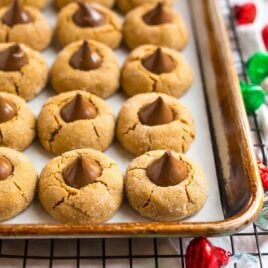 Brown butter peanut butter blossoms on a baking sheet