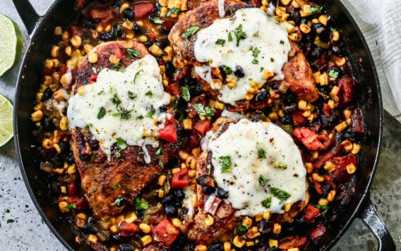 A cast iron skillet with cowboy chicken