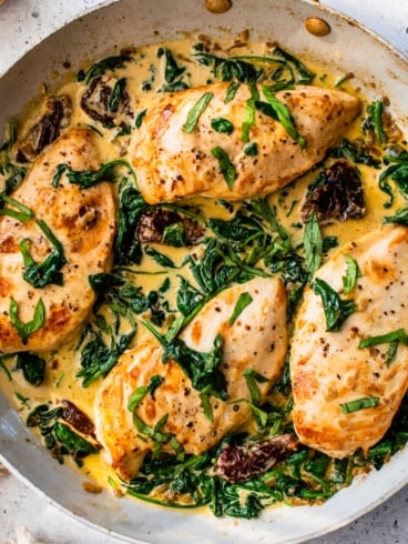 creamy tuscan chicken in a skillet