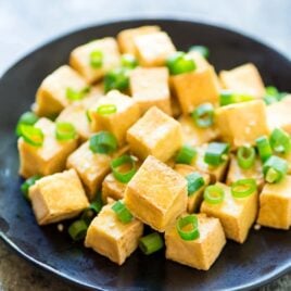 CRISPY Tofu the EASY way! No baking, pressing, or deep frying required. Use this trick to cook tofu that comes out perfectly every time, and is perfect for all of your favorite stir fries, sauces, and even salads! @wellplated