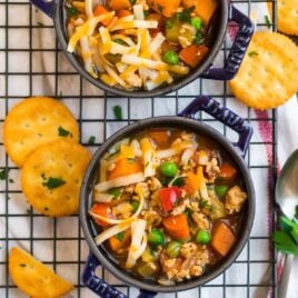 Two bowls of hamburger soup with vegetables