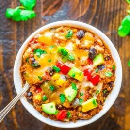 bowl of Crock Pot Mexican Casserole topped with melted cheese
