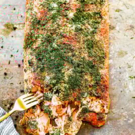 a side of smoked salmon being flaked with a fork