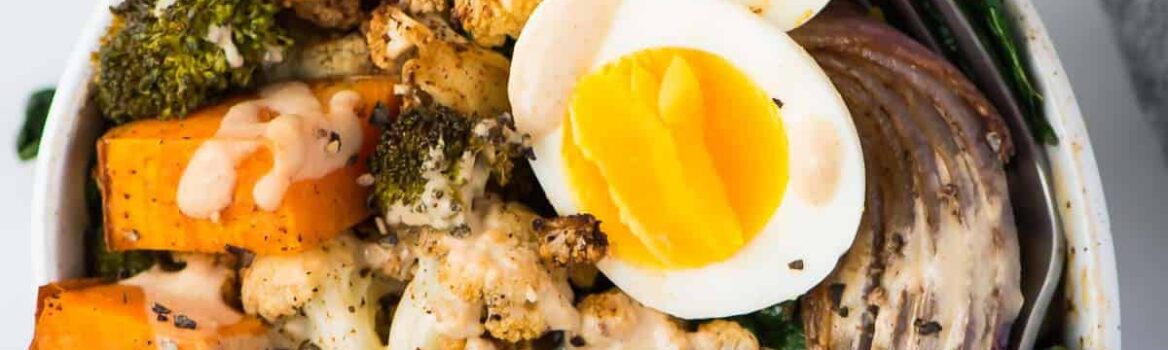 Easy and healthy Whole30 Vegetarian Power Bowl. Low carb, packed with roasted veggies, with a creamy and delicious Whole30 dressing. Top with a soft boiled egg for a filling, high protein vegetarian meal! Dairy free, gluten free, grain free, and Paleo compliant.