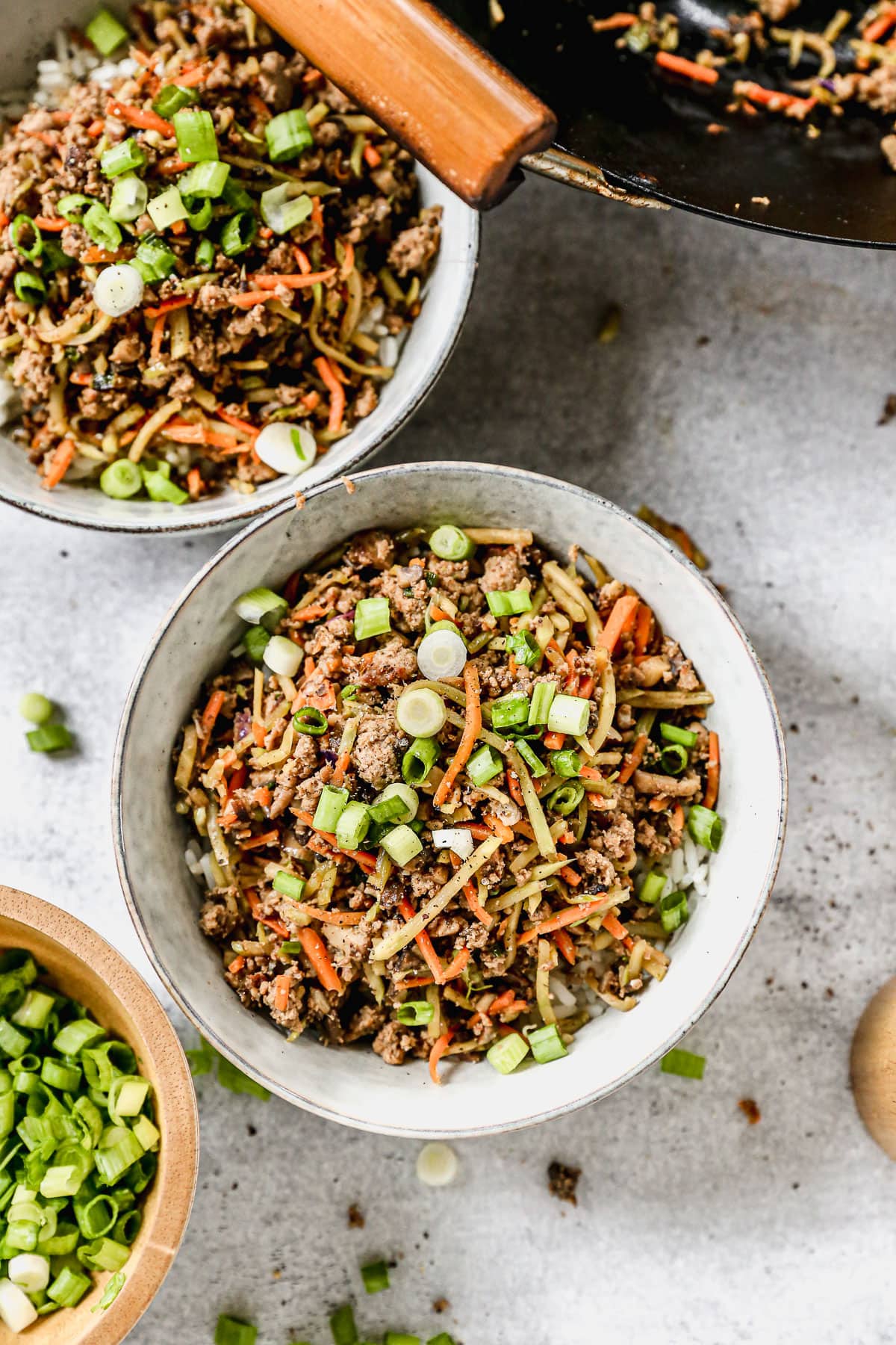 two bowls of healthy egg roll in a bowl with coleslaw mix and egg