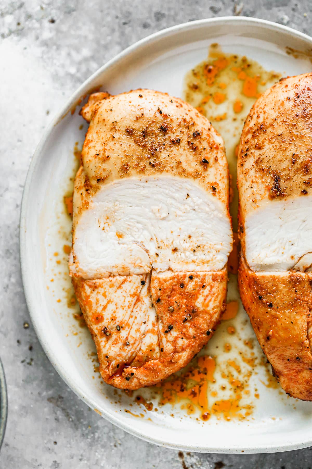 Wet Brined Baked Chicken Breast cut in half
