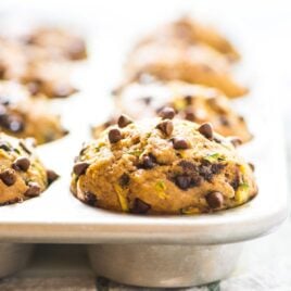 muffin pan full of Chocolate Chip Banana Healthy Zucchini Muffins