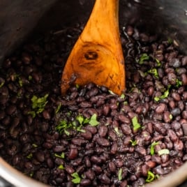 black beans in instant pot with cilantro for garnish