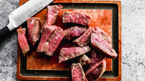 beef being sliced for easy beef stroganoff recipe