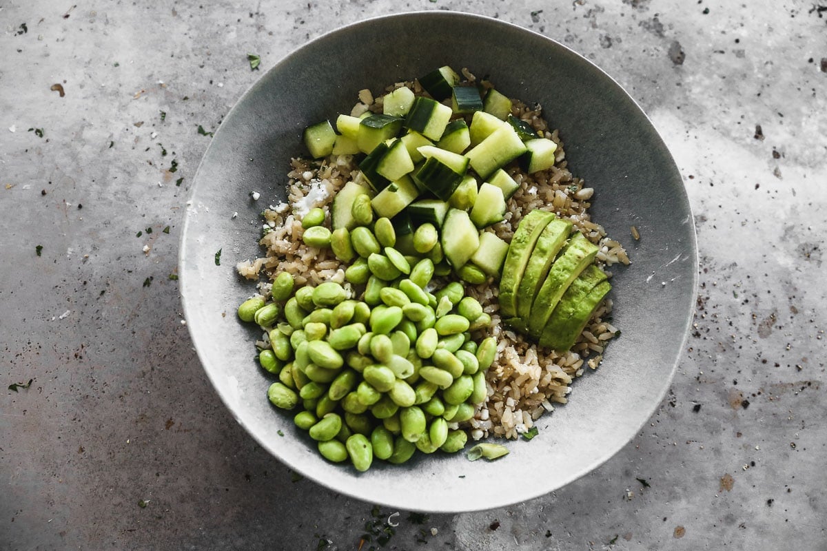 edamame, cucumber, and avocado added to rice for bowls