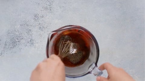whisking homemade bbq sauce for crockpot ribs