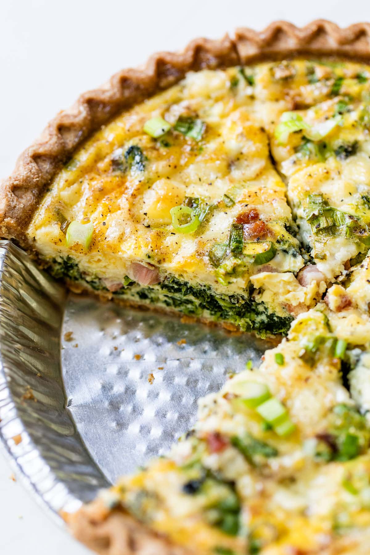 quiche in an easy crust sliced and ready to be served