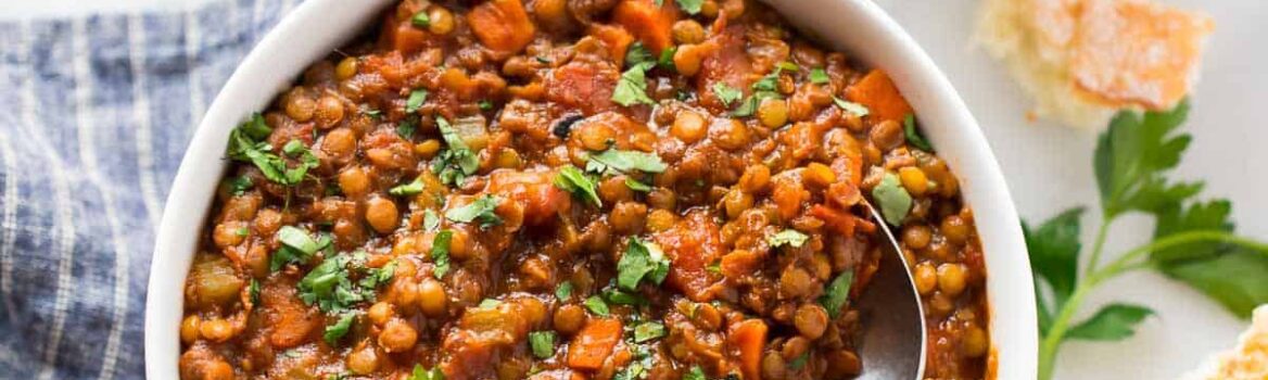 Instant Pot Lentil Soup - an easy, healthy recipe for French lentil soup made in the electric pressure cooker. So simple, hearty, and delicious! Gluten free, vegan, and freezer friendly. Recipe also includes stovetop method and tips to add ham or use red lentils or brown lentils instead. #healthy #soup #vegan