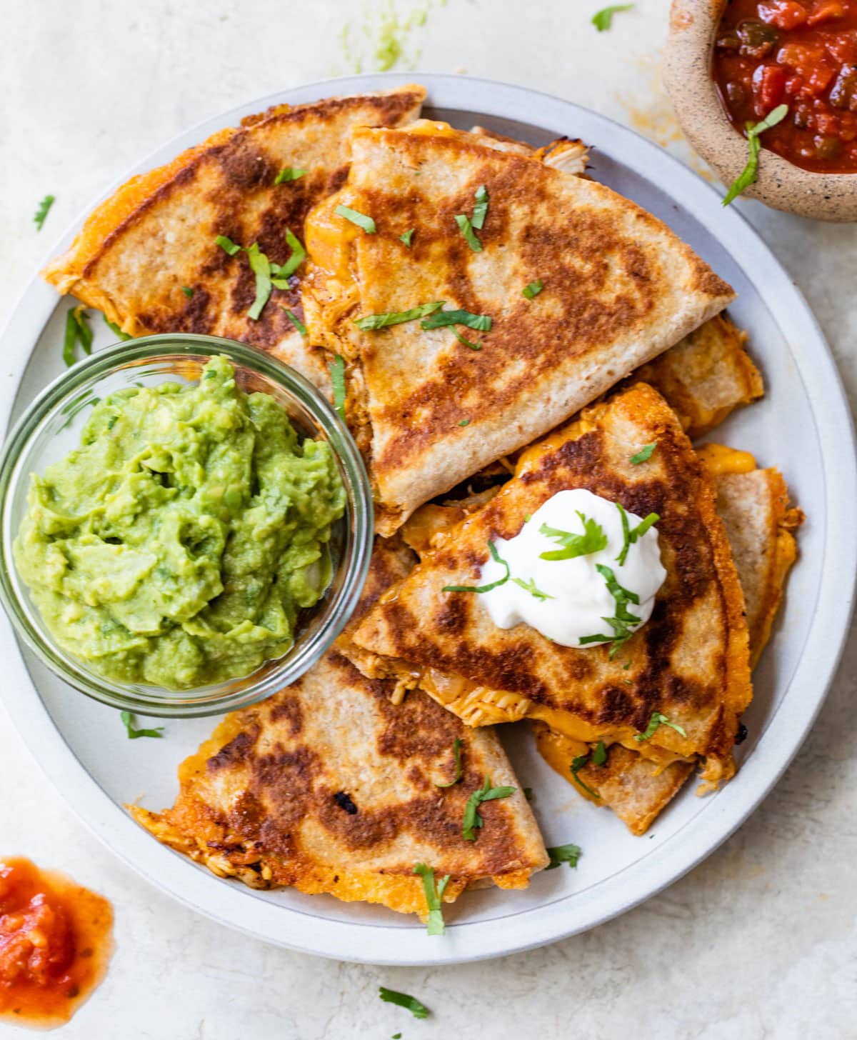Chicken quesadilla on a plate with guacamole
