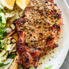 juicy grilled pork chop on a plate
