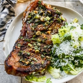 Pork steak on plate with salad