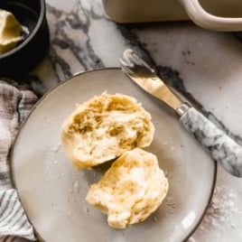 homemade dinner roll with butter on a plate