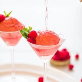 Raspberry Champagne Floats. TWO INGREDIENTS! A fun pink dessert-meets-cocktails for your next New Year’s Eve, bachelorette party, bridal shower, or Valentine’s Day. Recipe at wellplated.com | @wellplated