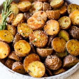 a bowl of crispy red potatoes seasoned