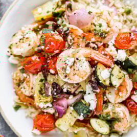 A bowl of sheet pan Mediterranean shrimp