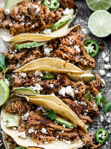 Slow cooker pork carnitas in tortillas