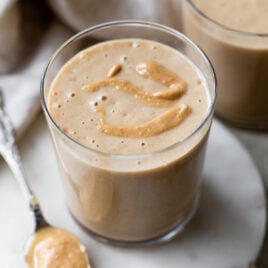 a glass with a thick date banana shake