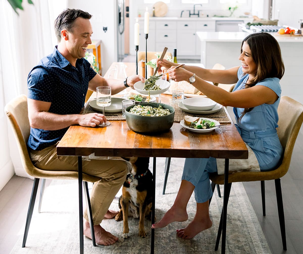 Erin Clarke and Ben Clarke of the healthy, easy, budget friendly recipe blog Well Plated with their dog Teddy