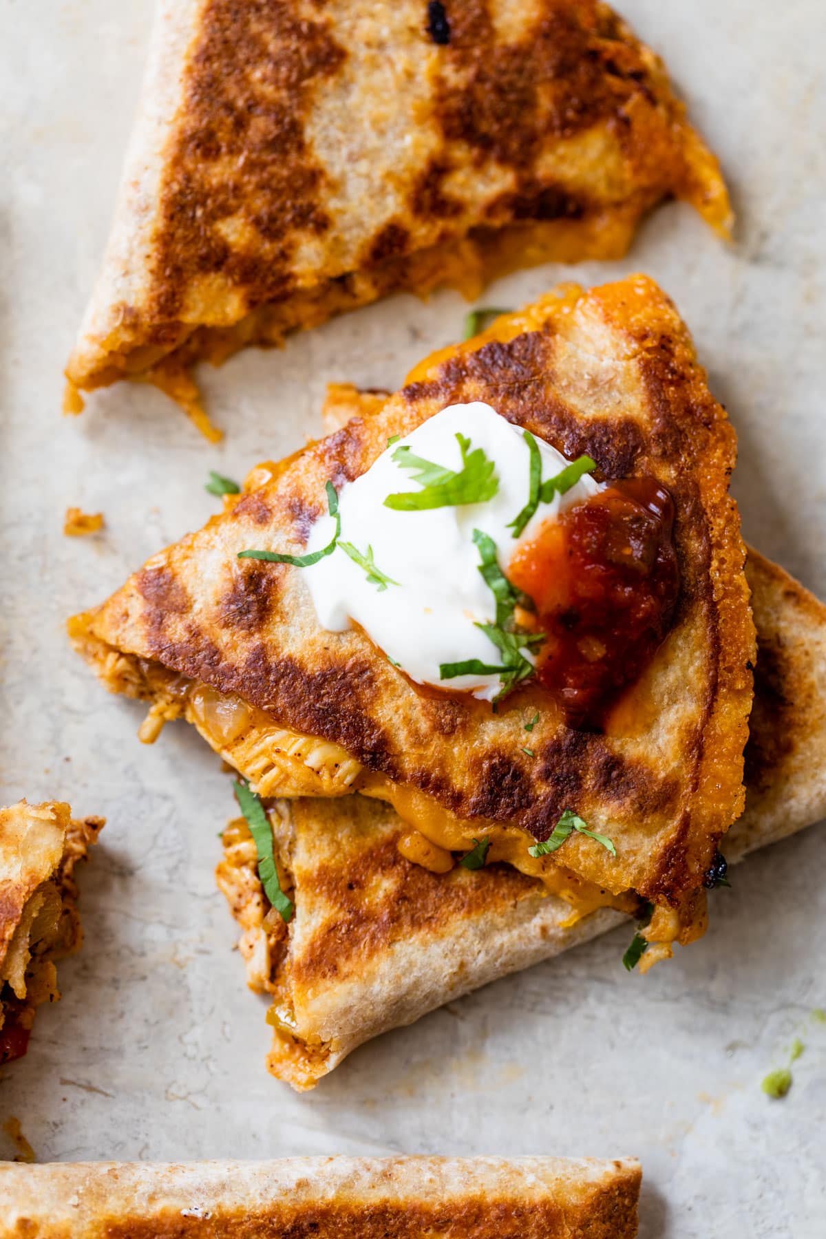 Chicken quesadilla with sour cream and salsa