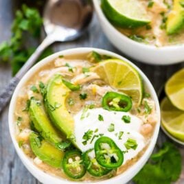 White chicken chili in bowls with toppings