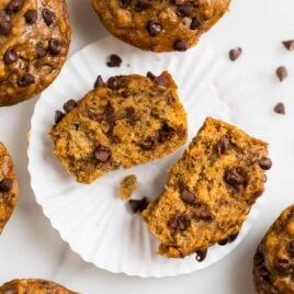 Moist healthy banana chocolate chip muffins with applesauce. Easy, vegan, and whole wheat, these simple muffins are perfect for healthy breakfasts! Clean eating and kid friendly.